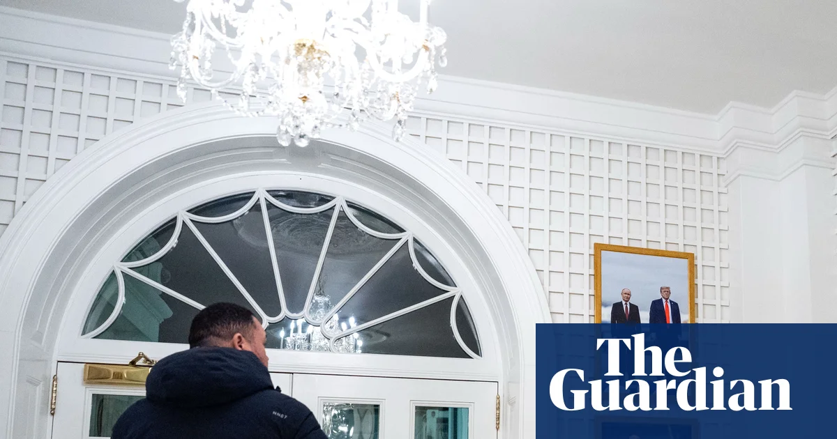 Critics aghast as White House displays framed photo of Trump with Putin